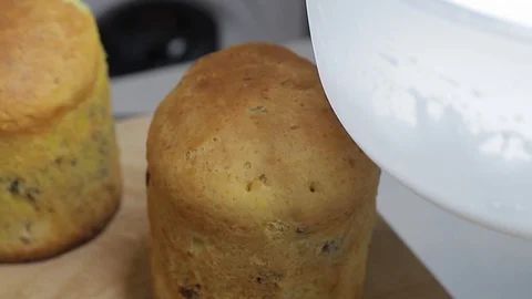 Glaze is pouring on Easter cake, close-up. Stock Footage 128566944