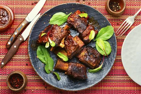 Glazed barbecue beef ribs with herb Stock Photos