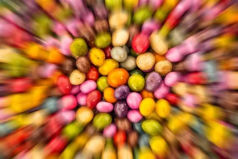 Glazed candy dragee motion blur lines background base festive yellow green Stock Photos