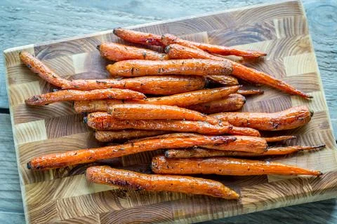 Glazed carrots on the baking tray Stock Photos
