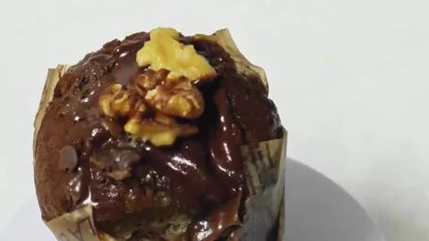 Glazed chocolate walnut muffin with copy space. 库存影片 345293016