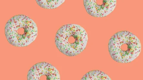 Glazed donuts rotating around donut on orange background, 3d video animation. Stock Footage 123232022