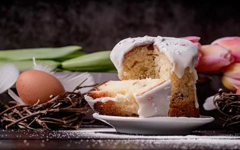 Glazed Easter cake on dark rustic background Stock Photos