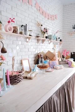 Glazed Easter cake on kitchen counter decorated for Easter Stock Photos