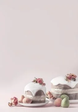 Glazed Easter cakes decorated with dry tea rose flowers on pastel pink Stock Photos