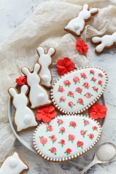 Glazed Easter cookies in the shape of Bunny and eggs. Stock Photos