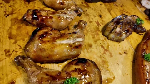 Glazed Grilled Chicken Pieces on Rustic Wooden Board in Thai Street Market Stockbeeldmateriaal 335206194