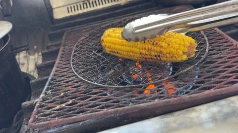 Glazed grilled corn on the cob with charred kernels, finishing, Japan Stock Footage 343078399