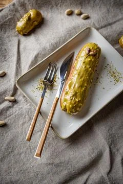 Glazed mini eclairs Stock Photos