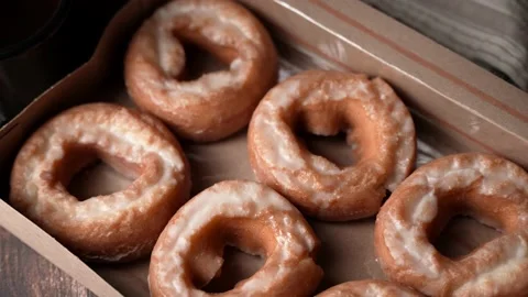 Glazed old fashioned style doughnut on dark background Stock Footage 157993285