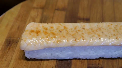 Glazed salmon top of the rice maki, sushi rolls preparation. Video stock 131997553