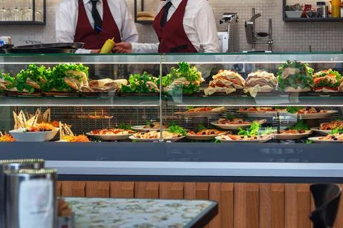 Glazed showcase inside a cafe with fresh Italian dishes and herbs in Milan, n Stock Photos