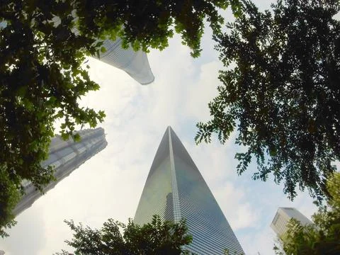 Glazed skyscraper from below with wide angle and blue sky Stock Photos
