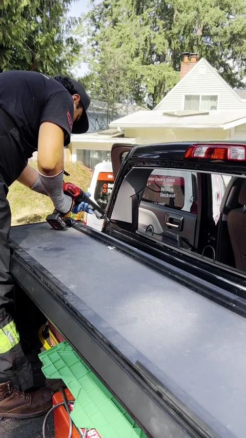 Glazier Technician preparing and glueing windshield for installation Stock Footage 290512817