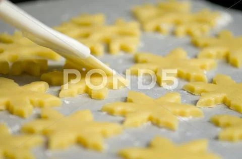 Glazing cookies before backing Stock Photos