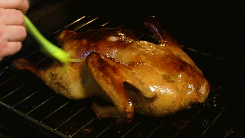 Glazing in Progress of a Delicious Roasted Bird 스톡 동영상 277559874