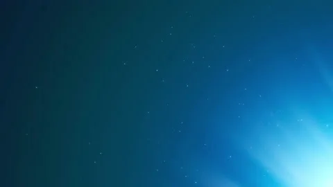 Gleaming Light Piercing In a Blue Atmosphere With Particles Motion Background Vídeo Stock 143172131
