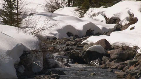 Gleaming river flows down stream bed. Video stock 36775614