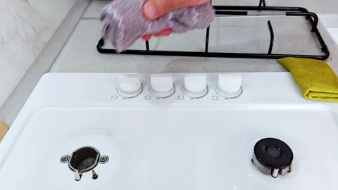Gleaming Stove Burners: A Step-by-Step Kitchen Cleaning Ritual Stock-Footage 313784241