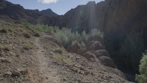 Glide Cam shot of rock formations in Morocco during noon Stock Footage 100300925