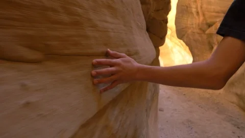 Glide camera close-up of hand sliding along red-rock walls, Utah. Stock Footage 100648566