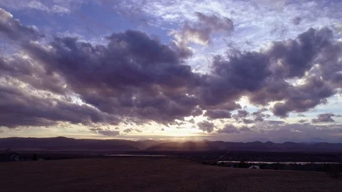 Glide over Field to Sunset Stock Footage 73531539