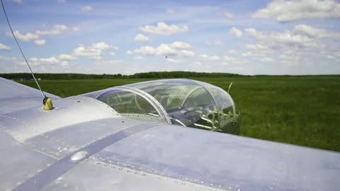 Glide shoot of Glider on the field On a background of green grass Video stock 85507298