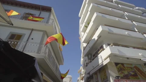 Glide shot of Spanish flag waving in the wind Stock Footage 140057779
