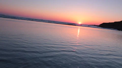 Glidecam footage of beach in Devon at sunset Stock Footage 141264485