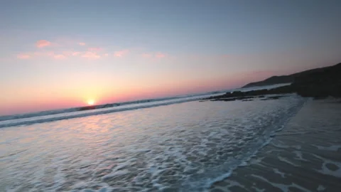 Glidecam footage of beach in Devon at sunset Stock Footage 141264507