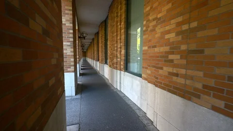 Glidecam through brick corridor building on the University of Washington campus. Stock Footage 107950480