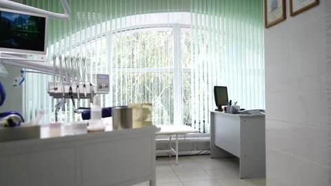 Glidecam wide angle panorama view of dentist's cabinet, dentist chair with Stock Footage 142122102