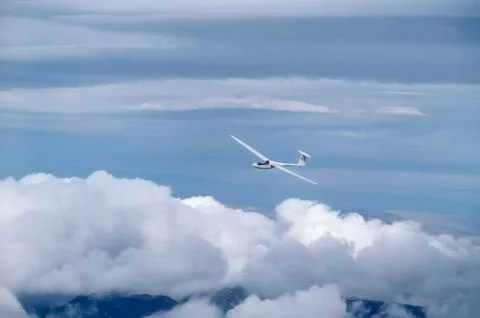 Glider between clouds Stock Photos