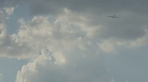 The glider floats in the air among the clouds and follows the wind Stock Footage 56182779