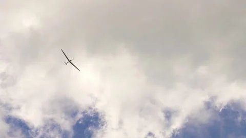 Glider flying through the blue sky and white clouds. Stock Footage 214024757