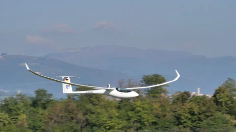 Glider with jet engine turbine low pass ... | Stock Video | Pond5