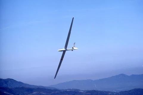 Glider over mountains Stock Photos