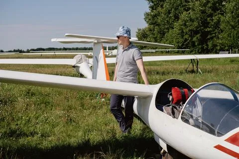 Glider pilot getting ready for flight on small motorless aircraft Stock Photos