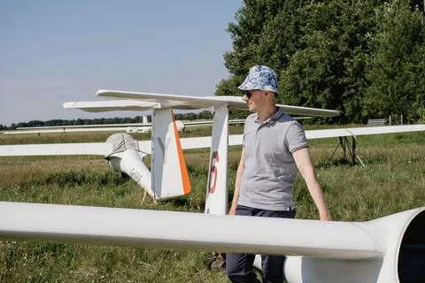 Glider pilot getting ready for flight on small motorless aircraft Stock Photos