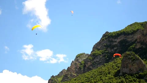 Gliders fly in the mountains Stock Footage 213875615