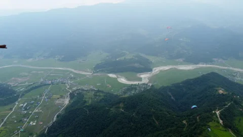 Gliders Flying Over Misty Landscape In The Himalayan. Paragliding In Video stock 259740390