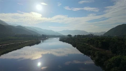 Gliding Above Mirror River Through Mountain Valley Stock Footage 336857086
