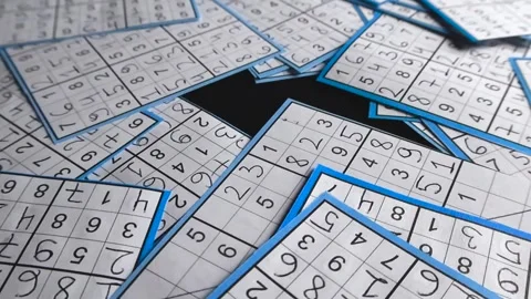 Gliding Camera Showing Solved Sudoku Puzzles on Dark Background Stock Footage 341910004