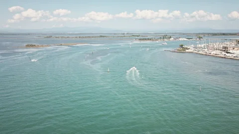 Gliding drone aerial forward into Grado Lagoon boating channel 4K Vídeos de archivo 331351296