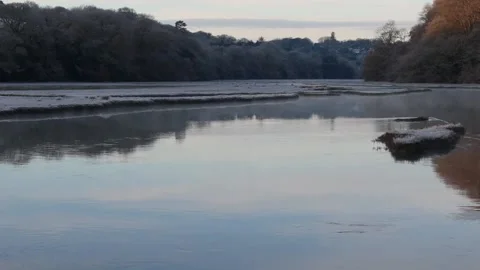 Gliding Drone Low Over Misty Estuary Water At Sunrise In Winter Stock Footage 301093749