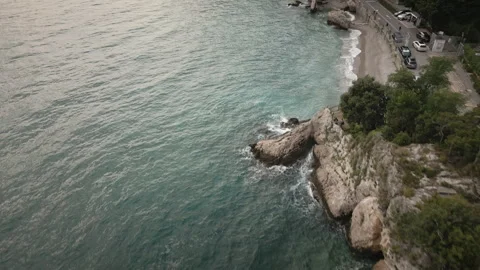 Gliding drone moves forward over rocky Trieste bay beach 4K 스톡 동영상 331049139