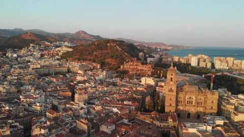Gliding drone revealing Malaga's ancient Alcazaba fortress and cathedral at.. Stock Footage 344052080