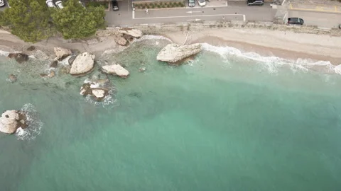 Gliding drone top-down forward along Trieste shoreline and rocks 4K Vídeo Stock 331097861