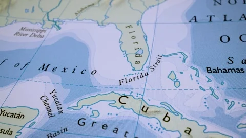 Gliding from florida to cuba over a physical atlas map Stock Footage 341750022
