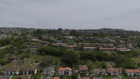Gliding Left Then Rising Up Over Neighborhood Stock Footage 339712731